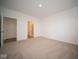 Main bedroom with carpet and en-suite bathroom access at 5607 Tart Blvd, Indianapolis, IN 46239