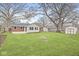 Large backyard with firepit, storage shed, and grassy area at 5651 Ralston Ave, Indianapolis, IN 46220