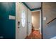 Front entry with teal walls and powder room at 5837 Baron Ct, Indianapolis, IN 46250