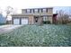 Two-story house with double garage and snowy lawn at 5837 Baron Ct, Indianapolis, IN 46250