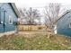 View of backyard with trees and detached garage at 621 N Denny St, Indianapolis, IN 46201