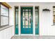 Teal front door with glass panels and sidelights at 621 N Denny St, Indianapolis, IN 46201