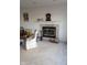 Living room with fireplace, wood mantle, and carpeted floor at 6784 Stanhope Way, Indianapolis, IN 46254