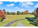 Aerial view of home, expansive lawn, and trees at 691 S 1100 E, Zionsville, IN 46077