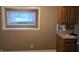 Kitchen features a window seat and wood cabinets at 734 Hattie Dr, Anderson, IN 46013