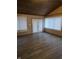 Bright sunroom with wood ceiling, vinyl flooring and doors at 734 Hattie Dr, Anderson, IN 46013