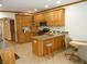 Kitchen with light wood cabinets, granite countertops, and stainless steel appliances at 7346 Rooses Way, Indianapolis, IN 46217