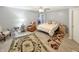 Bright bedroom with a queen-size bed and a ceiling fan at 7936 Yucca Ct, Camby, IN 46113