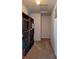 Long hallway with built-in shelving and neutral wall color at 8298 S Firefly Dr, Pendleton, IN 46064