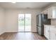 Kitchen with patio door leading to backyard and stainless steel appliances at 924 Delegate Dr, Shelbyville, IN 46176