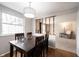 Charming dining room with wood floors and a view into the living room at 9415 Thornwood Dr, Indianapolis, IN 46250