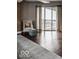Bedroom with hardwood floors, city view, and a comfy seating area at 110 E Washington St # 900, Indianapolis, IN 46204
