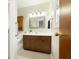 Bathroom with wood vanity, tiled floor, and shower at 1189 N County Road 475 E, Avon, IN 46123