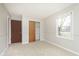 Well-lit bedroom with double door closet and carpet flooring at 1189 N County Road 475 E, Avon, IN 46123
