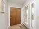Bright entryway with tile floors and wood closet doors at 1189 N County Road 475 E, Avon, IN 46123