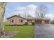 Brick ranch house with 2-car garage and landscaped lawn at 1189 N County Road 475 E, Avon, IN 46123