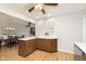 Kitchen features a breakfast bar and wood cabinetry at 1189 N County Road 475 E, Avon, IN 46123