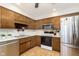 Updated kitchen with stainless steel appliances and wood cabinetry at 1189 N County Road 475 E, Avon, IN 46123