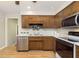 Bright kitchen, stainless steel appliances, wood cabinets, and hardwood floors at 1189 N County Road 475 E, Avon, IN 46123