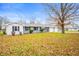 Side view of ranch home showcasing landscaping and detached garage at 2789 W 900 S, Pendleton, IN 46064