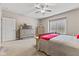 Bedroom with dresser, TV, and window with plantation shutters at 4444 W Prairie Gap, New Palestine, IN 46163