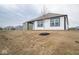 Landscaped backyard with a partially developed area at 5559 Tart Blvd, Indianapolis, IN 46239