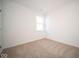 Simple bedroom with neutral carpeting and a window at 5559 Tart Blvd, Indianapolis, IN 46239