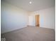 Spacious bedroom with neutral carpeting and access to hallway at 5559 Tart Blvd, Indianapolis, IN 46239