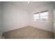 Spacious bedroom with neutral carpeting and a large window offering ample natural light at 5559 Tart Blvd, Indianapolis, IN 46239