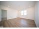 Large bonus room with wood-look flooring and multiple windows at 5559 Tart Blvd, Indianapolis, IN 46239