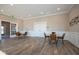 Bright and airy community lounge with tables and chairs at 5559 Tart Blvd, Indianapolis, IN 46239