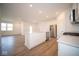 Modern kitchen with white cabinets, stainless steel appliances, and an island at 5559 Tart Blvd, Indianapolis, IN 46239