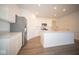 Modern kitchen with white cabinets, island, and stainless steel appliances at 5559 Tart Blvd, Indianapolis, IN 46239