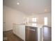 Kitchen island with white cabinets and quartz countertop at 5559 Tart Blvd, Indianapolis, IN 46239