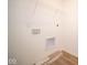 Bright laundry room with built-in shelving and vinyl flooring at 5559 Tart Blvd, Indianapolis, IN 46239