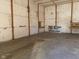 Empty barn interior with concrete floor at 5800 S State Rd 37, Tipton, IN 46072