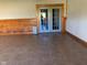 Common area with wood wall accents and French doors at 5800 S State Rd 37, Tipton, IN 46072