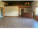 Open great room with high ceilings and a large bar at 5800 S State Rd 37, Tipton, IN 46072