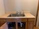 Small kitchenette with double sink and water filter at 5800 S State Rd 37, Tipton, IN 46072