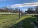 Property roadside view with chain link fence and road at 5800 S State Rd 37, Tipton, IN 46072
