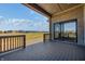 Composite deck with sliding glass door and view of backyard at 16298 Grand Cypress Dr, Noblesville, IN 46060