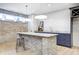 Basement bar with a brick-faced island, dark cabinetry and pendant lights at 16298 Grand Cypress Dr, Noblesville, IN 46060