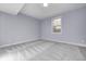 Spacious basement bedroom with light gray walls and patterned carpet at 16298 Grand Cypress Dr, Noblesville, IN 46060
