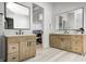 Bathroom with dual vanities, large mirrors and a view to the bedroom at 16298 Grand Cypress Dr, Noblesville, IN 46060