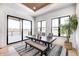 Sunlit dining area with sliding glass doors leading to deck and backyard views at 16298 Grand Cypress Dr, Noblesville, IN 46060