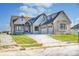 Stunning brick home with a three-car garage and landscaped yard at 16298 Grand Cypress Dr, Noblesville, IN 46060