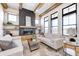 Bright living room with large windows, hardwood floors, and a stunning fireplace at 16298 Grand Cypress Dr, Noblesville, IN 46060