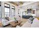 Living area with kitchen views, hardwood floors, and comfy seating at 16298 Grand Cypress Dr, Noblesville, IN 46060
