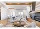 Light-filled living room with hardwood floors and a view of the front entrance at 16298 Grand Cypress Dr, Noblesville, IN 46060