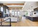 Open living area with vaulted ceilings, hardwood floors, and a cozy fireplace at 16298 Grand Cypress Dr, Noblesville, IN 46060
